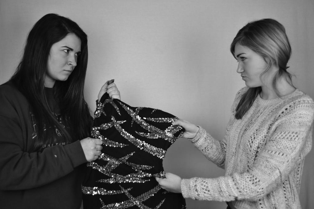 Photo by William Wheatley
Emily Larkin (11) and Lindsey Heidelbach (11) fight over a dress.  Hereford Prom groups on Facebook have created conflict between girls who are searching for unique gowns.