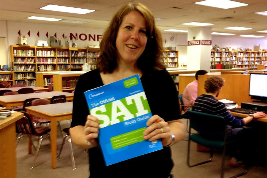 The+Sat+was+administered+on+June+7+at+schools+all+over+the+county.+Kimberly+Willard%2C+the+Sat+Prep+teacher%2C+poses+with+this+years+Sat+prep+book.