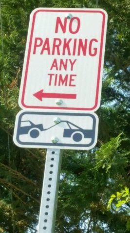 This sign indicates cars parked along Monkton Road will be towed.