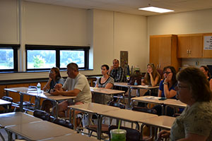 Parents visit their students classrooms and teachers at Back to School Night.