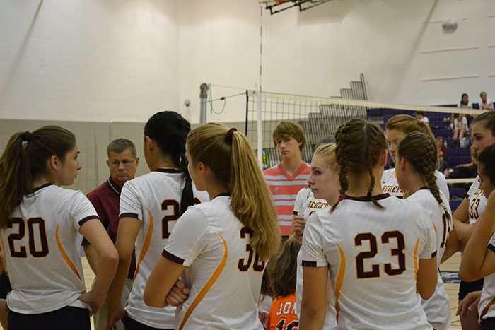 Daniel Cloud (17), who manages for the girls volleyball teams and plays a boys club team, stands among braids and ponytails. He said he would have tried out his freshman year had there been a boys team.
