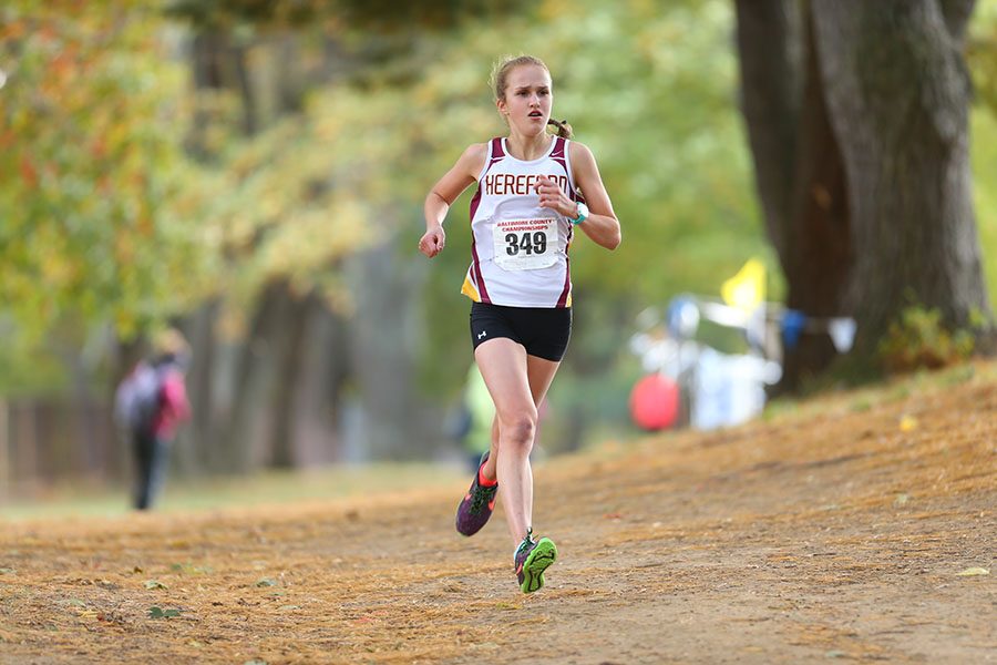 Kelly Wesolowski (17) runs for Hereford cross country. This is one of many successful races she has run since returning to the course after months of injury.