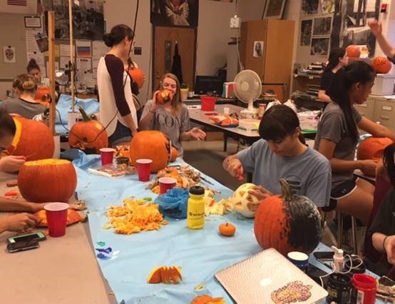 NAHS members gather to carve pumpkins for the 2016 Halloween season.