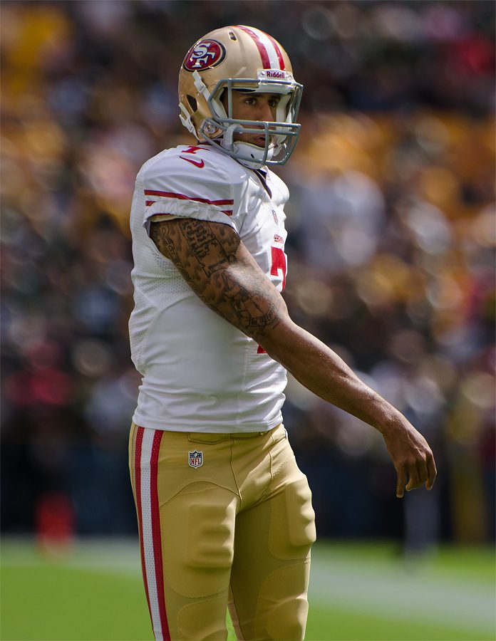 Kaepernick warms up before a game in 2012. He has come under scrutiny for his decision to not stand during the national anthem.