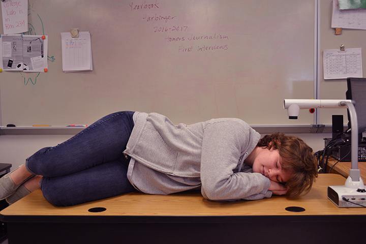 Emma Coleman ('17) catches some Z's during a spare moment in Advanced Journalism. The need for sleep is a common symptom of senioritis.