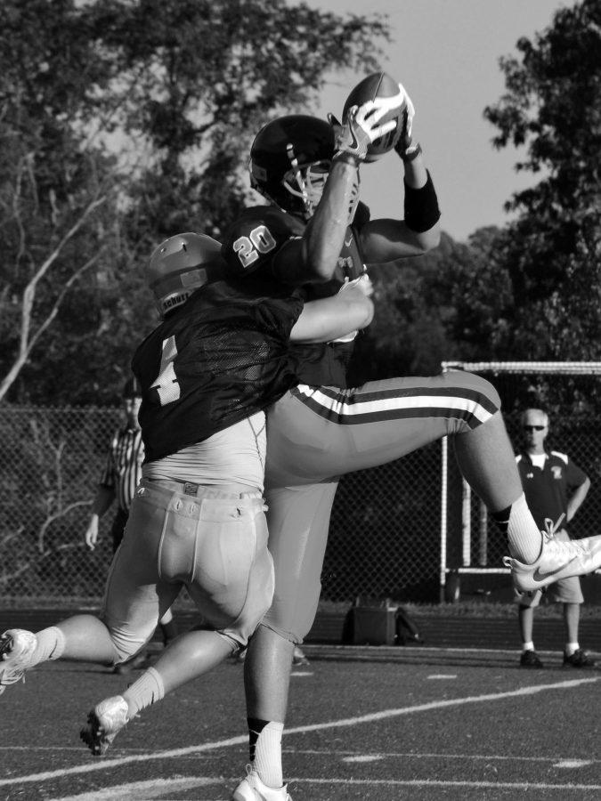 Zach Johnson ('17) intercepts a pass against Manshester. Johnson has caught two interceptions this season