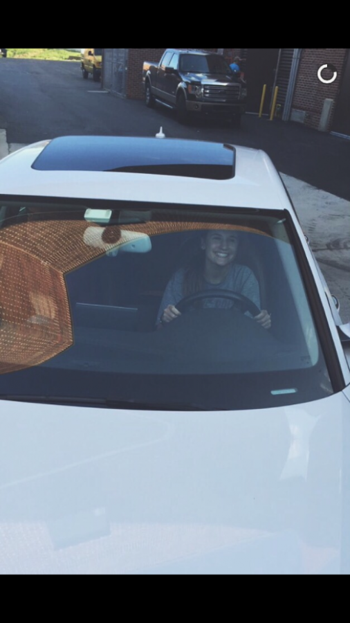 Nicole Burkoski ('18) smiles at other drivers on her way to school.