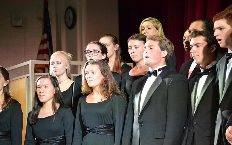 The Choir performs for their audience. In the auditorium, they sang in their Winter Concert.