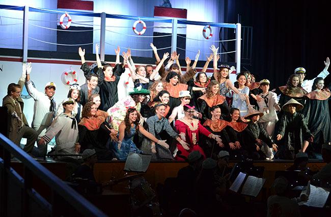 The Anything Goes cast poses, arms open to the audience, at the end of a full cast dance number on the last night of the show, Dec. 3.