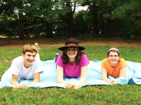 My siblings and I lie on a blanket in our backyard on a Sunday, chatting as we breathe the fresh air.