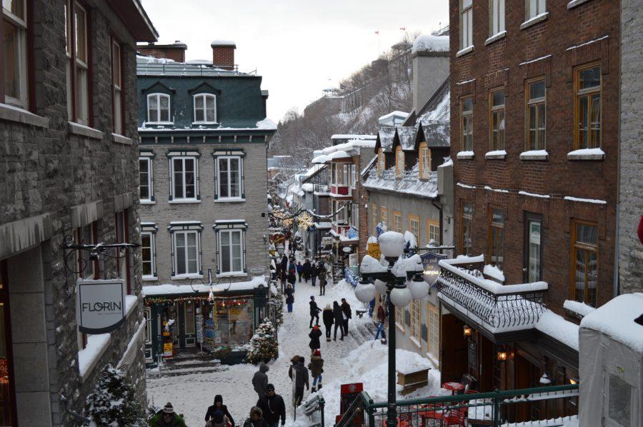 Natives and tourists visit shopping avenues during the snowy winter season in Quebec, where the French language is widely spoken.