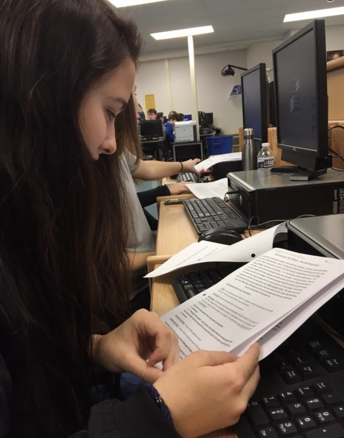 Sophia Rubino (19) begins researching her topic on the computer
