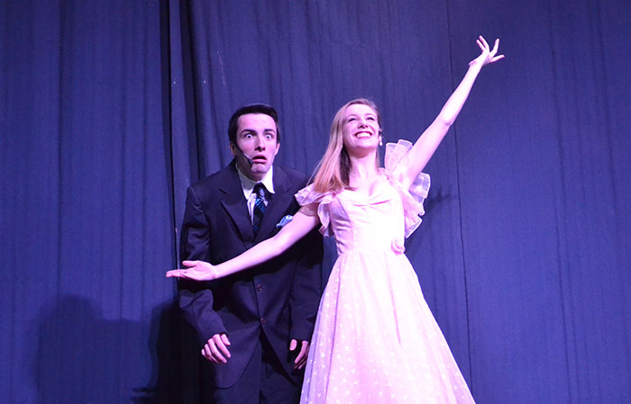 Brendan Iverson (17) and Lizzy Pease (17) strike an unlikely pose at the conclusion of their Variety Show act. The two performers played an engaged couple in Anything Goes this past fall. 