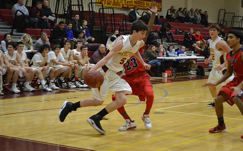 Point Guard Mason Greenspan ('19), drives baseline against a defender in the second half.