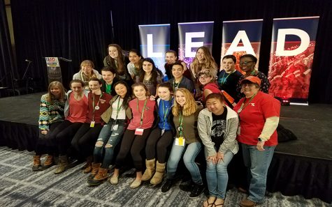 Leaders and advisors across Baltimore County sit on a stage at the National Association of Student Councils Leadership Conference. They attended the conference on Feb 3.