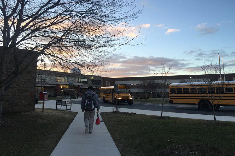 Grafton Griffey ('19) walks to school in the morning. He carried his books in the cold weather.