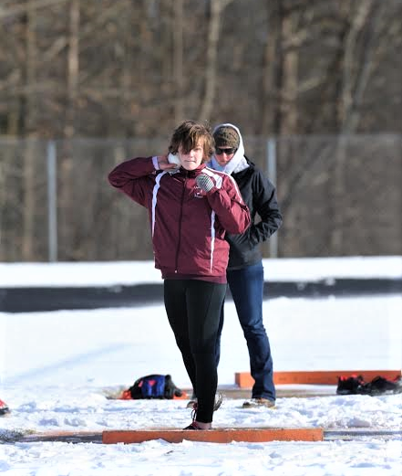 I set myself up to throw shot put, my coach Sarah Koehn looking on, during my first indoor track season as a junior. Looking back, I see that all the time I spend throwing shots into the snow is worth the pride that comes with being a Hereford athlete. 