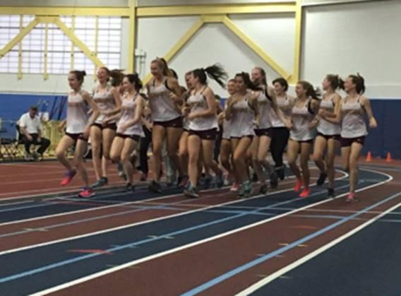 The girl's track team jog around the track. They became the 2A State Champions with a total of 89.5 points.