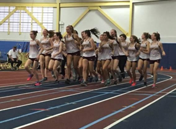 The girls track team jog around the track. They became the 2A State Champions with a total of 89.5 points.