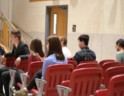 Students sit and listen to fellow speakers talk about their Four-Way Test topic. The competition was held on March 13