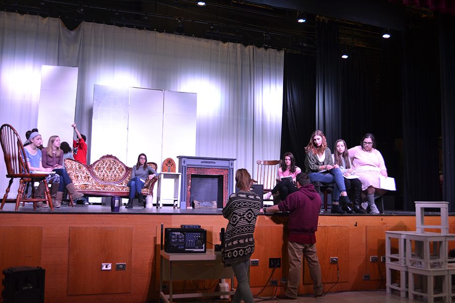 Actors listen to directions at rehearsal of The Skin of Our Teeth. The show dates were moved to April 21 and 22.