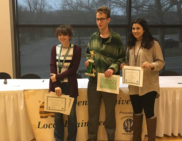 Daily, Holbrook, and Sakenijad pose for a picture while holding their awards. They competed on Feb 25.