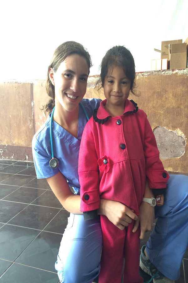 Kathryn Getter ('18) smiles with a young girl she treats. "I was the one who had seen her and done her evaluation. A week later she came back and gave me a hug because she wasn't sick anymore and that moment made m life worth while."