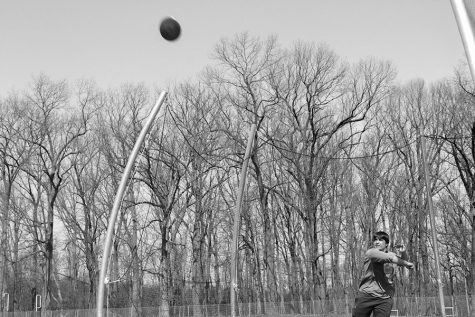 Jack Marshall (19) throws a disc from the new discus cage. It was installed this last December, once the old one was taken down. located up at the track, on the corner of the turf, the new cage has curved poles that better guard spectators from free-flying implements. 