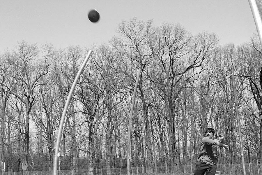 Jack Marshall (19) throws a disc from the new discus cage. It was installed this last December, once the old one was taken down. located up at the track, on the corner of the turf, the new cage has curved poles that better guard spectators from free-flying implements. 