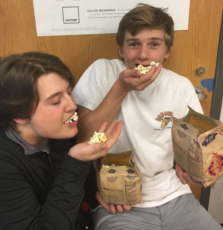 Photo by Jen Barranco

Sam Wanamaker (18) and Jimmy Danielczyk (18) hoard the last two bags of popcorn in journalism class. I enjoy eating popcorn while working for the harbinger Danielczyk  said. 