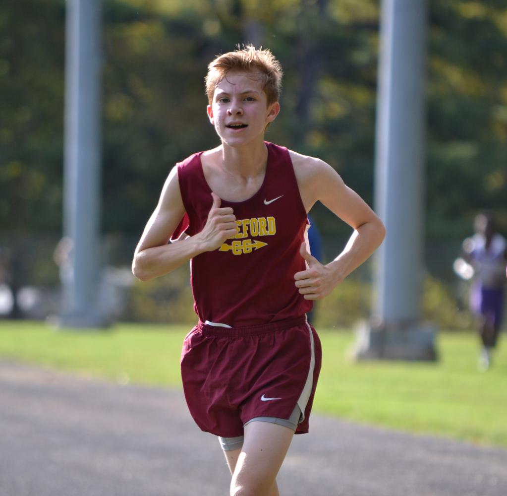 Jacob Robertson (21) runs in the Winters Mill Cross Country Meet. Robertson set a personal record of 22 minutes and 24.9 seconds for the 5000 meter race.