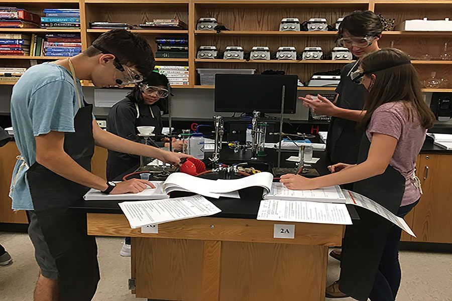 Nathan Hamidi (’19) and Jenna Tognola (’18) write down measurements taken in their first AP Chemistry lab. 
“This is really just an intro [lab] so that we can get used to the environment. There’s also the application for it in that The Mill theoretically uses this salt to so we’re trying to find out what it is,” said Tognola.
“We’re trying to find an unknown chloride salt by precipitating a chlorine ion from the solution and taking it from there; we’ll be able to do well on future labs by learning the ins and outs of the lab environment with this [introductory lab].” 