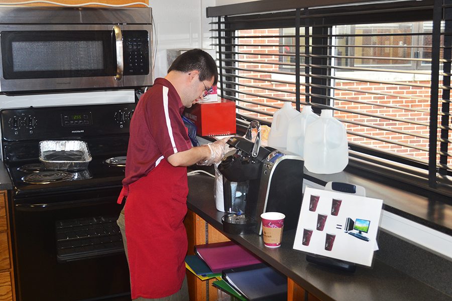 Tim Soots ('18) and his classmates make $1 coffee for teachers. Soots delivered the coffee to the teachers' rooms along with cream and sugar. "The students make and deliver all the coffee to teachers around the school," Special Education Teacher Caitlin Mackenzie said. 