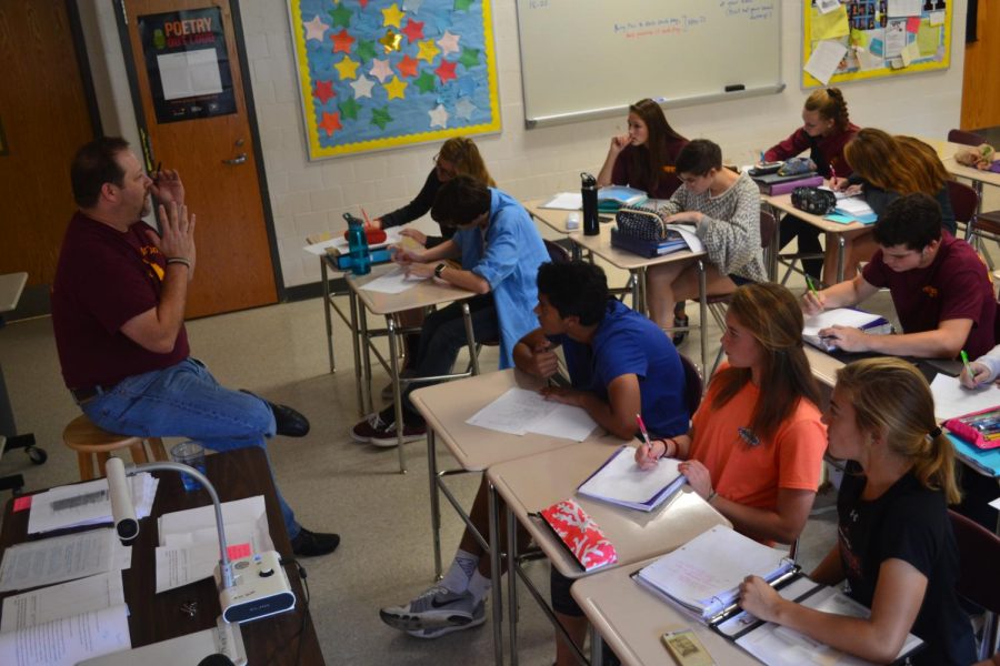 Science teacher Charlie Fluharty speaks to reporters about his life and career. "I spent about 20 hours every weekend doing scholl work ," Fluharty said. 