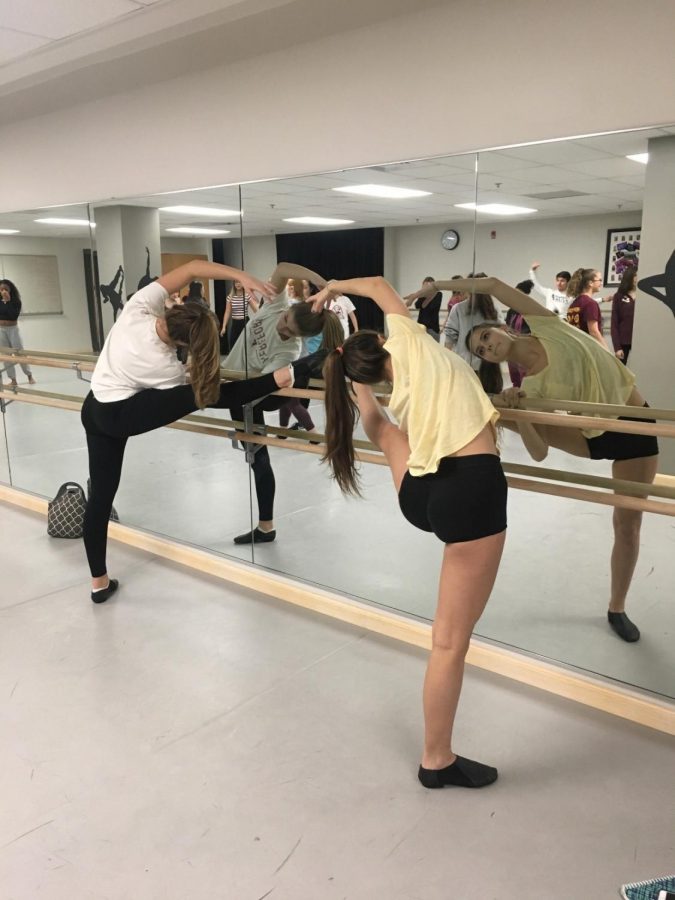 Megan Sabo (’20) and Elsbeth Supplee (’20) stretch before Junior Dance Company practice. This is both of their first years participating in the club. “It was really fun just to get a different set of choreography and to have dance outside of my actual class, “Supplee said. “It’s challenging to get a piece together that quickly, but I thought it was a good challenge.”