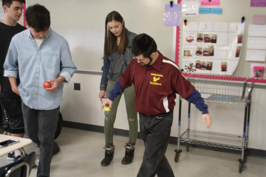 Best Buddies members Luke Caplan ('19), Zach McKennedy ('19) and Tim Soots ('18) learn  choreography from Vice President Hailey Clark ('19). The club has prepared multiple different acts for their upcoming talent show in March.