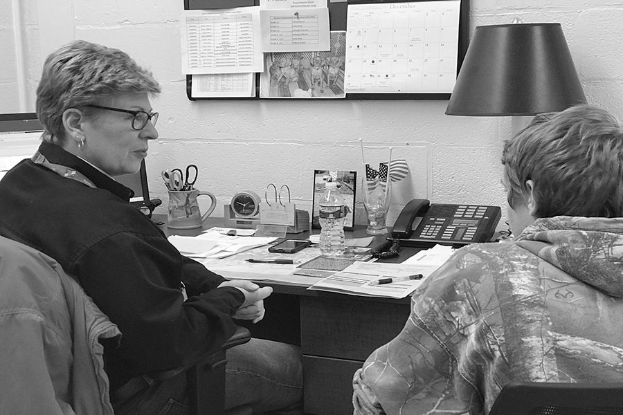 Kyle Lane (21) registers for his 2018-2019 classes with Guidance Counselor Ellen Fitzkee. Students have the option to challenge themselves through AP courses.