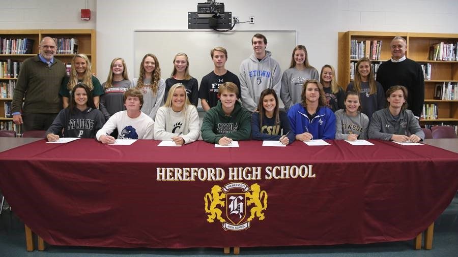 These+athletes+will+take+the+field+for+their+universities+in+their+freshmen+years.+Committed+DI%2C+DII%2Cand+DIII+athletes+of+the+Class+of+2018+gathered+in+the+Hereford+High+School+library+for+the+annual+Signing+Ceremony.+