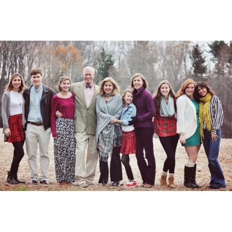 Ellie Clark (21) and Jane Clark (19) pose for a family photo. Ellie Clark said she looks up to her seven older siblings and strives to be successful like them. 