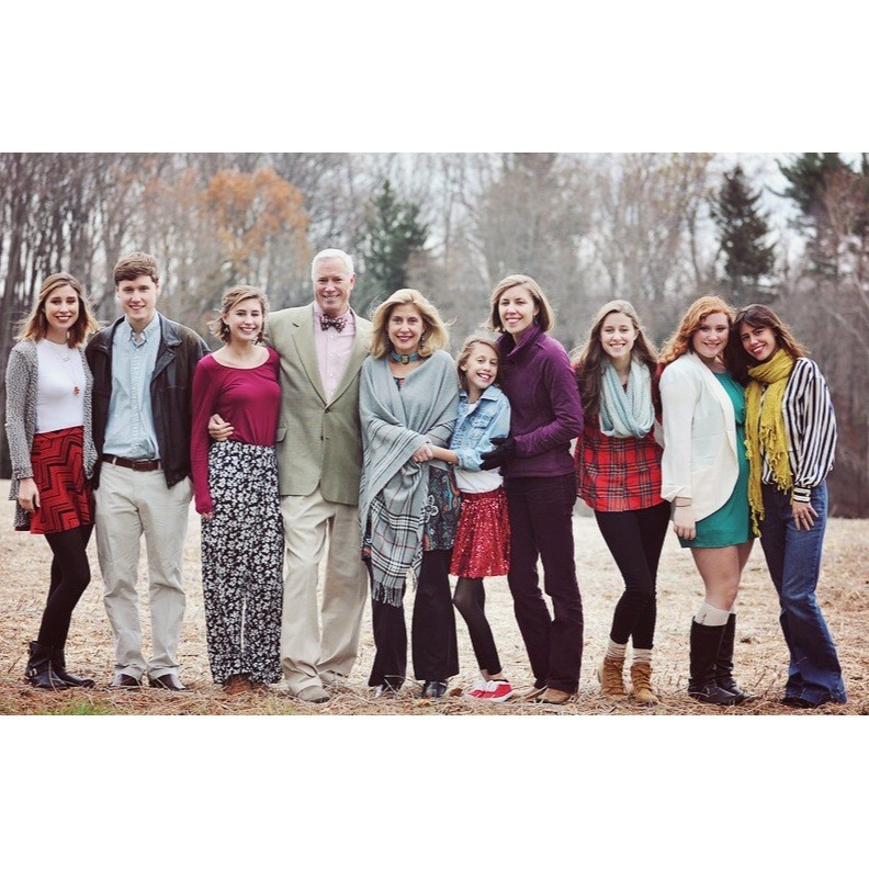 Ellie Clark (21) and Jane Clark (19) pose for a family photo. Ellie Clark said she looks up to her seven older siblings and strives to be successful like them. 