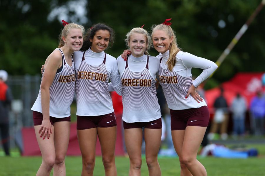 Hannah Weeren (18), Julia Watt (19), Bess Tiller (18), and Julia Zemanek (18) posing after placing first in their relay. They had a successful season. 