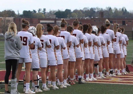 The Hereford varsity girls’ lacrosse team lines up for the National Anthem on their home turf, playing the Dulaney Lions for the senior game. 