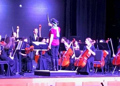 Music Department Chair Janet Sovich dresses like a swashbuckler and uses a sword as a baton. Orchestra performed “At World Ends” from the movie “Pirates of the Caribbean’s”.