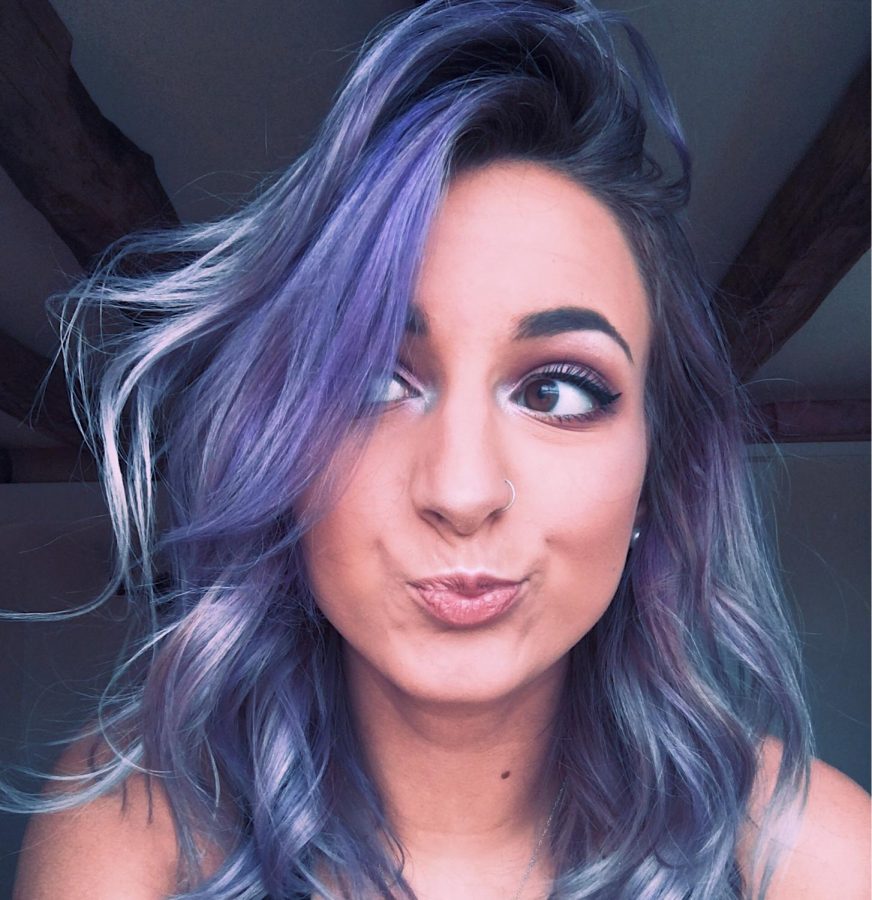 Gaige DuBois ('19) takes a selfie to show off her newly colored purple hair. After three attempts to perfect the look, she was pleased.