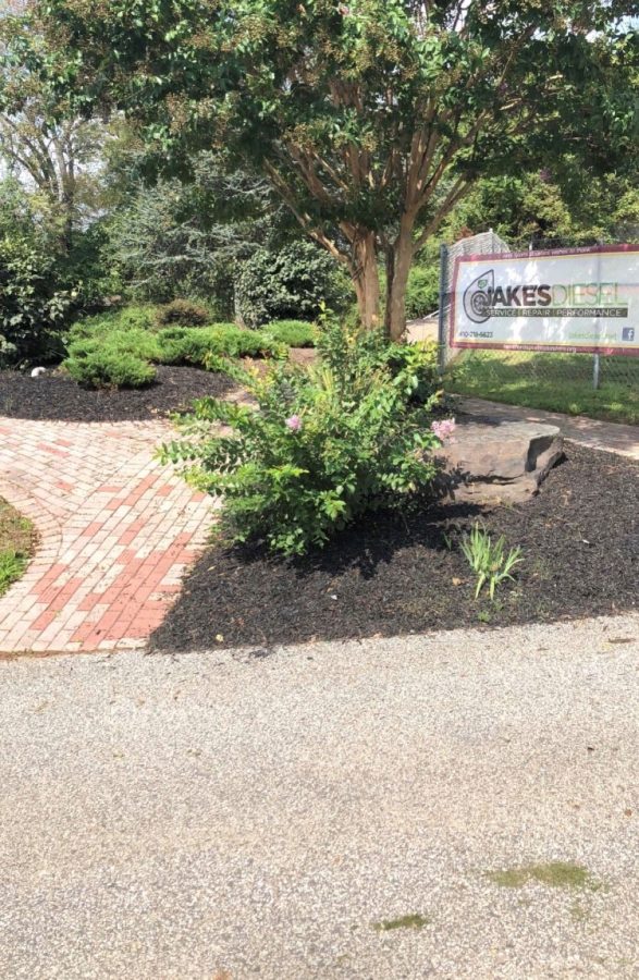 The garden in front of the stadium has been weeded and mulched. Volunteers from the Sports Boosters helped clean up this area.