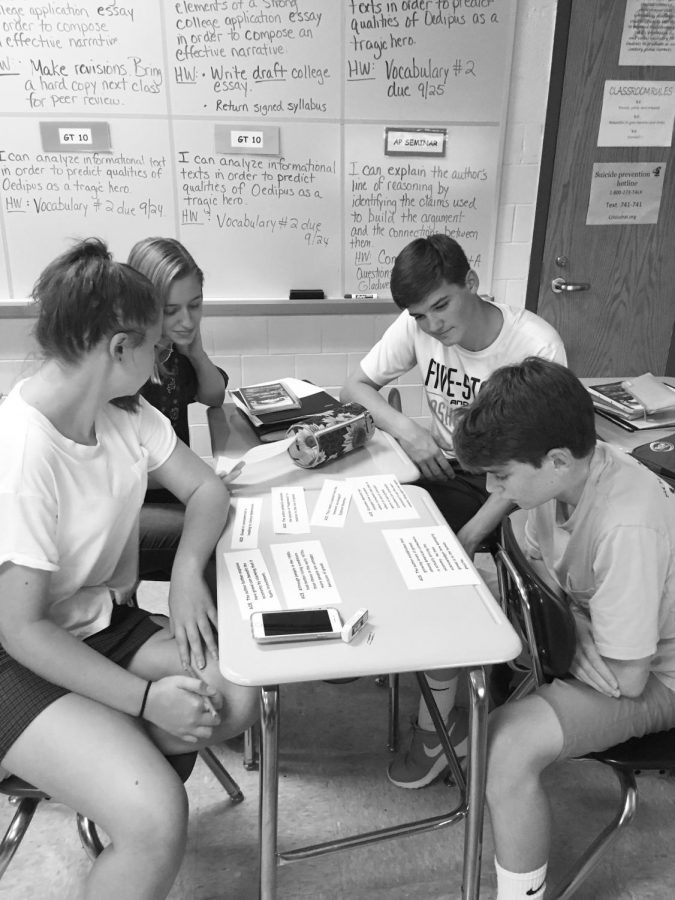 Students collaborate among each other, attempting to identify the argument, claims, and evidence in an argumentative article. This is part of the students’ daily routine in Seminar, helping them get used to what they would be doing for the AP test. 