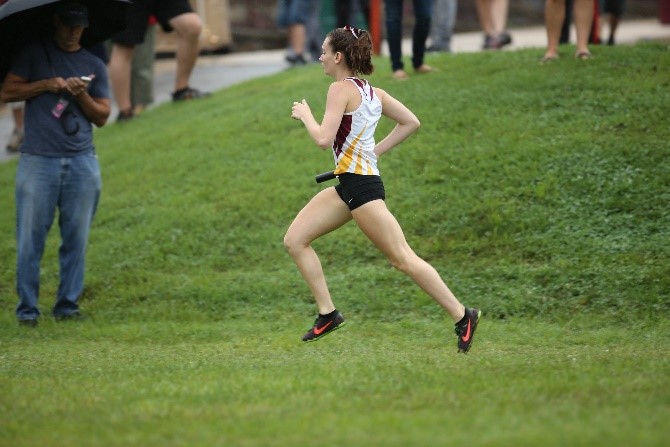 Konkus carries the baton to finish the last leg of the relay race at County Relays. Overall, team placed first at the meet. 