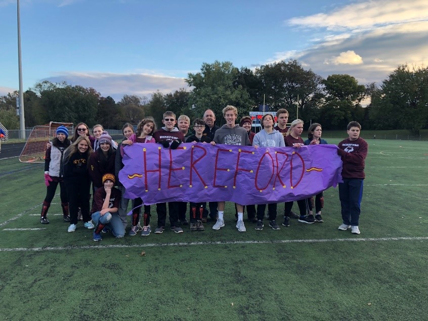 At the beginning of the Pumpkin Bowl each team runs through a tunnel carrying their school’s banner. The tournament commenced when a Franklin player kicked the first orange soccer ball. 