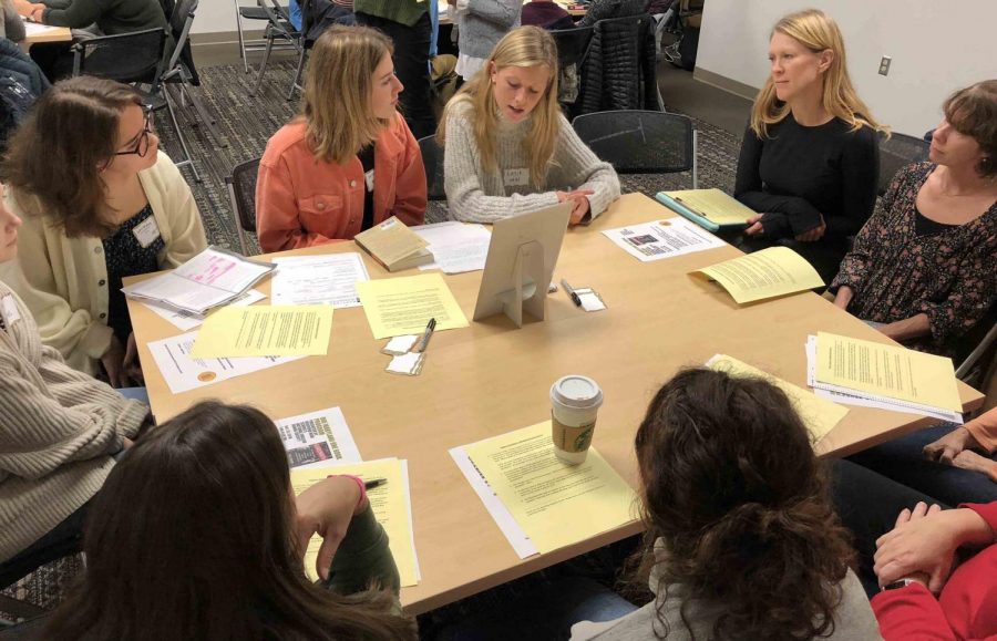 Victoria Westra (20) asks questions to further the conversation about the book Bloodsworth. Members wrote questions before the book talk to be prepared to lead the group discussion.