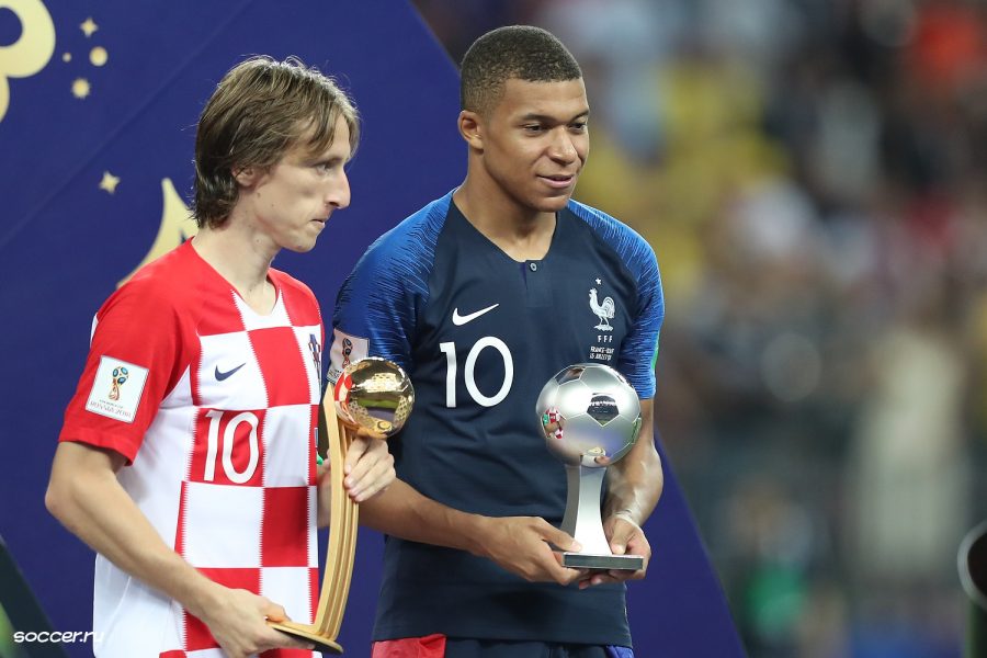 Luka Modric and Kylian Mbappe stand together after the World Cup Finals in Russia. The two participated in the hard-fought championship with France defeating Croatia 4-2; Modric won the player of the tournament and Mbappe won young player of the tournament.